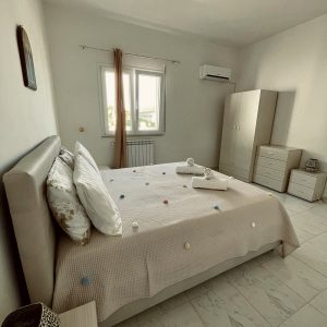 Bedroom with wardrobe and bed